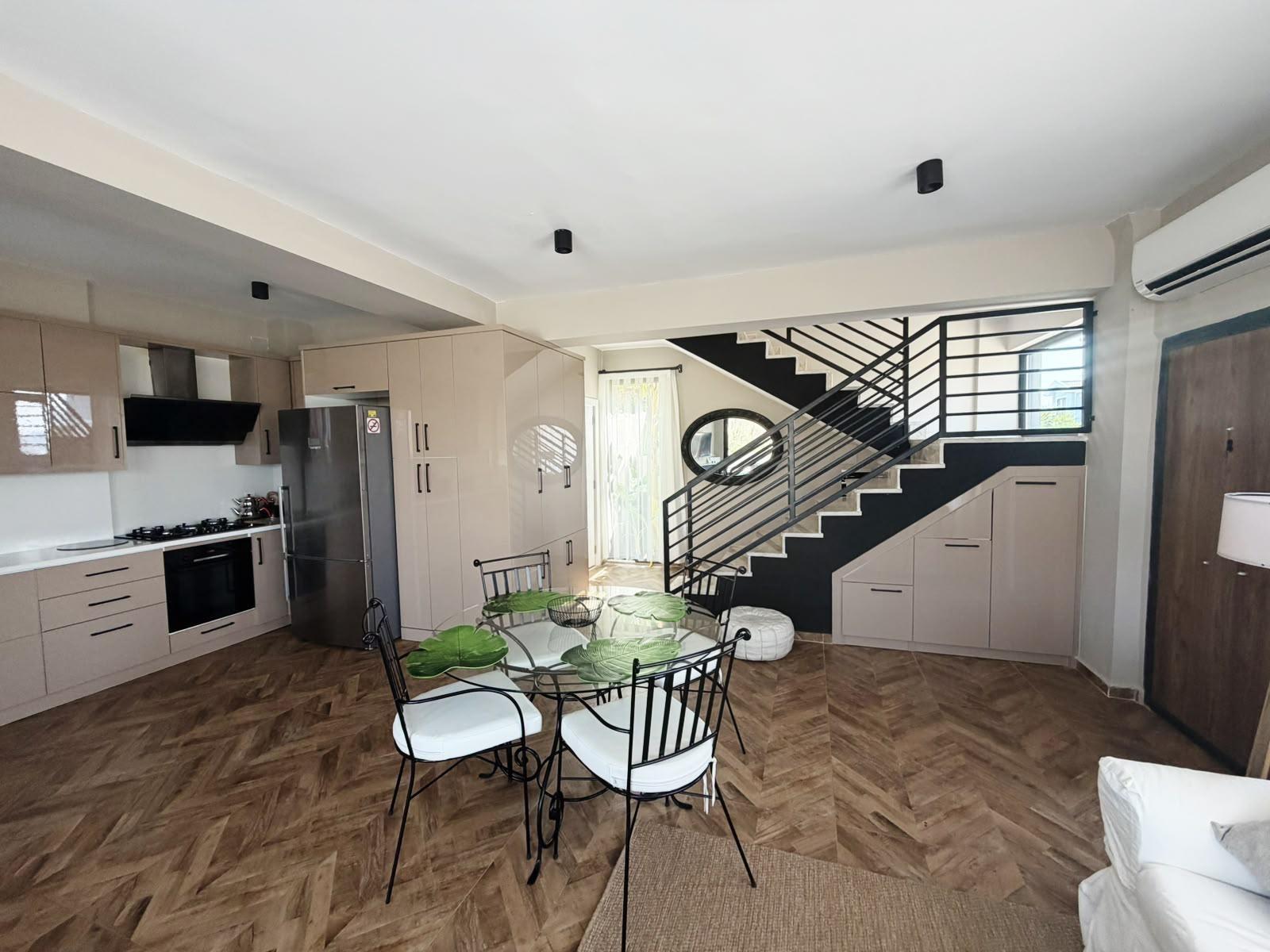 Dining table beside the staircase