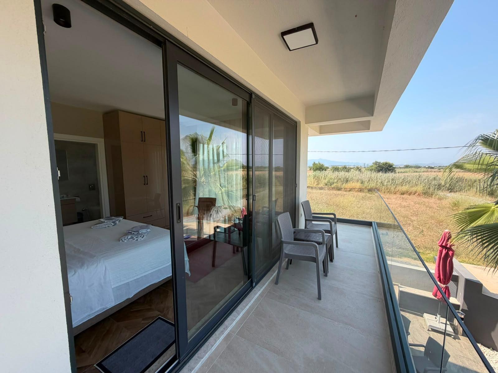 Balcony with palm trees and garden view