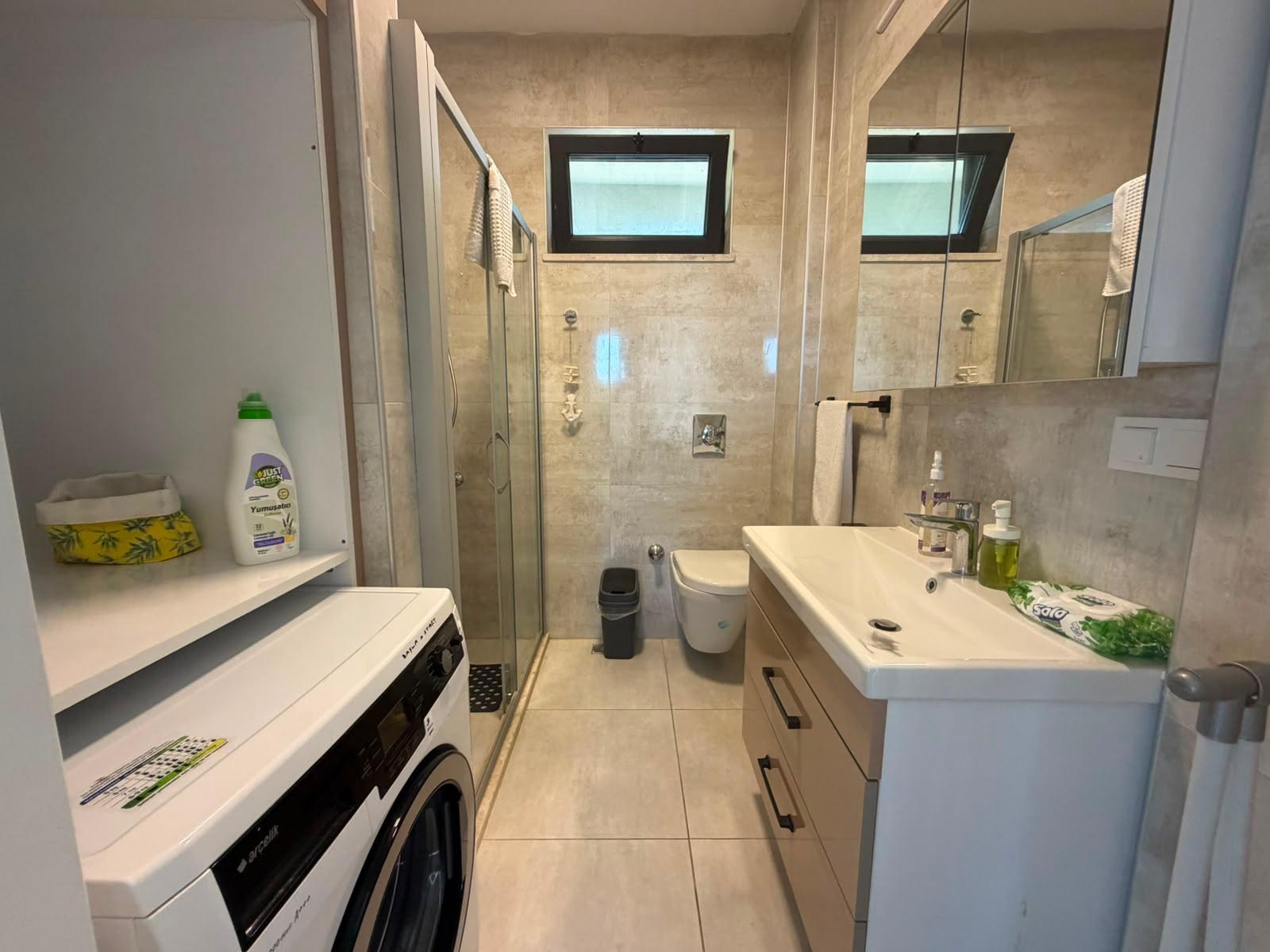Half bathroom with washing machine