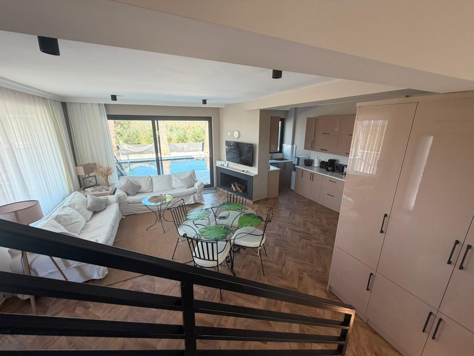 Living room seating area with pool view
