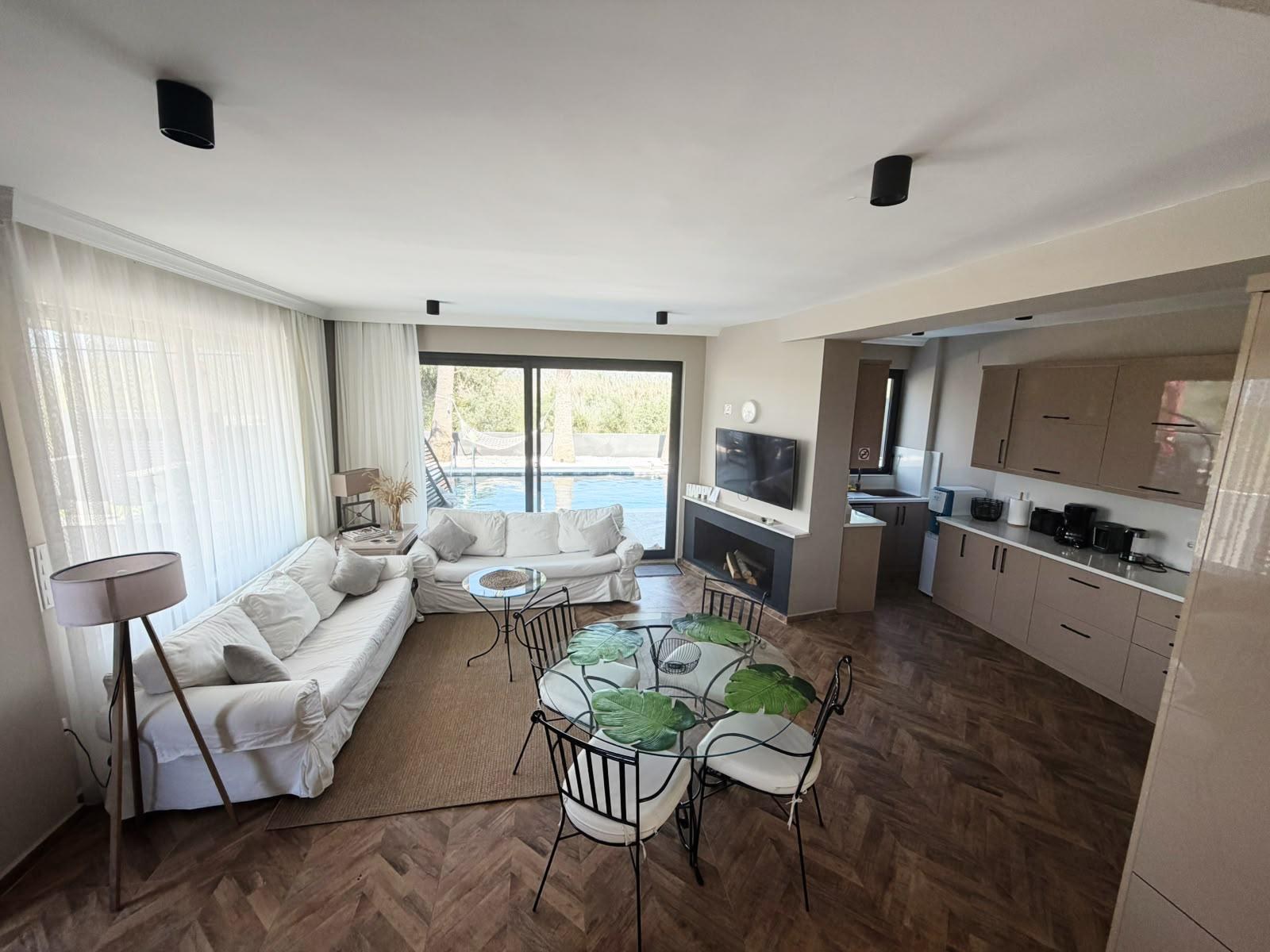 Living room with fireplace and dining table